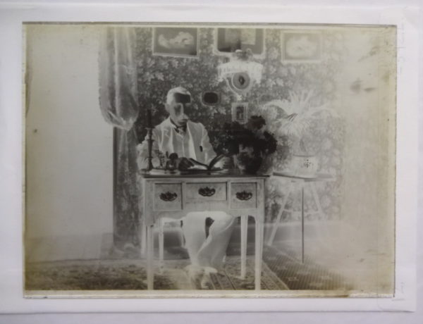 Dr Baker at a desk