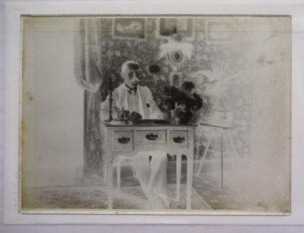 Dr Baker at a desk