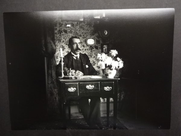 Dr Baker at a desk