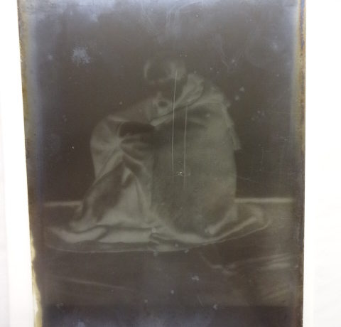 Sir Richard Burton sitting on the floor in his Jubbah