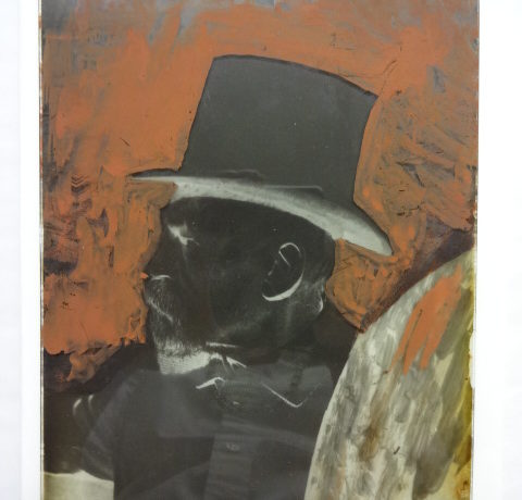 Sir Richard Burton wearing a top hat with background coloured red