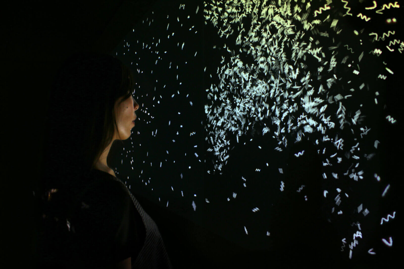 Plumial Space detail from London College of Fashion, Arcade East Gallery, 2018. Image showing the interaction with the particle animation produced for Plumial Space 