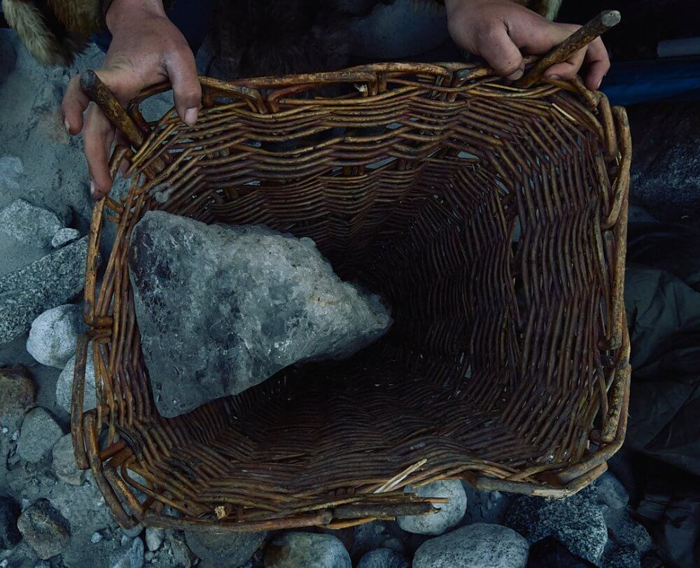 A chunk of ice in a wicker basket